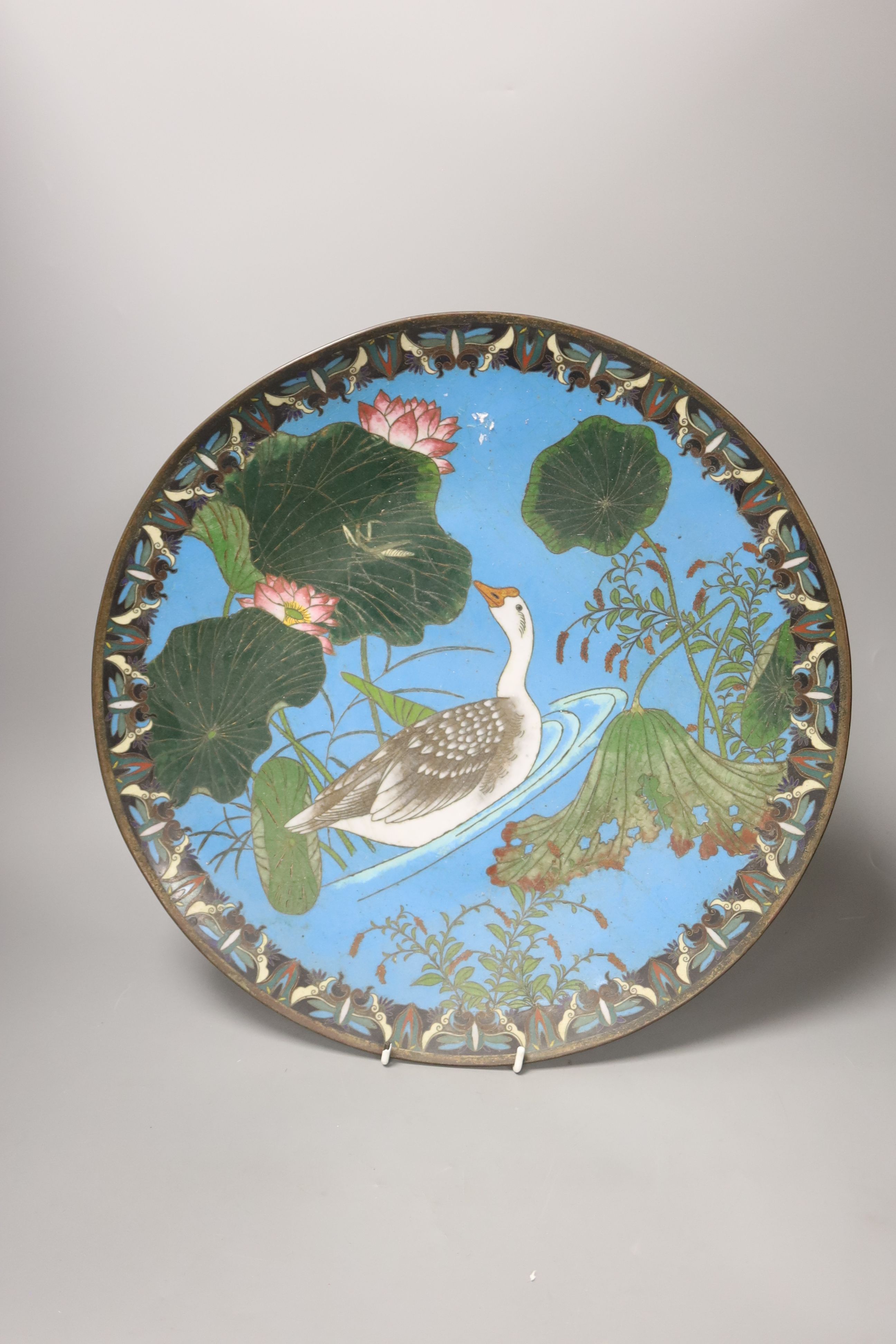 A Japanese cloisonne charger, diameter 39cm, together with a stamp album